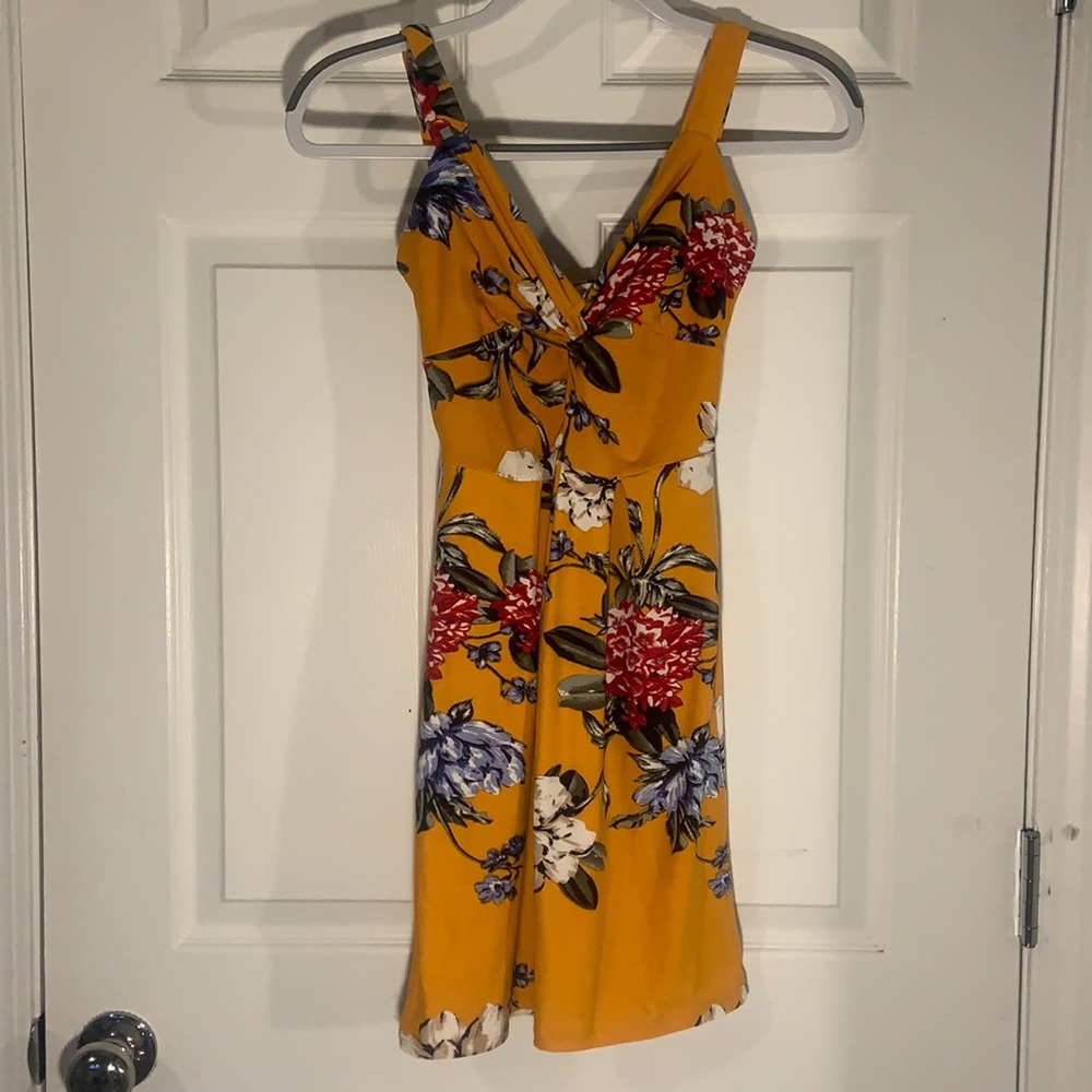 Yellow/Orange colored dress with floral pattern